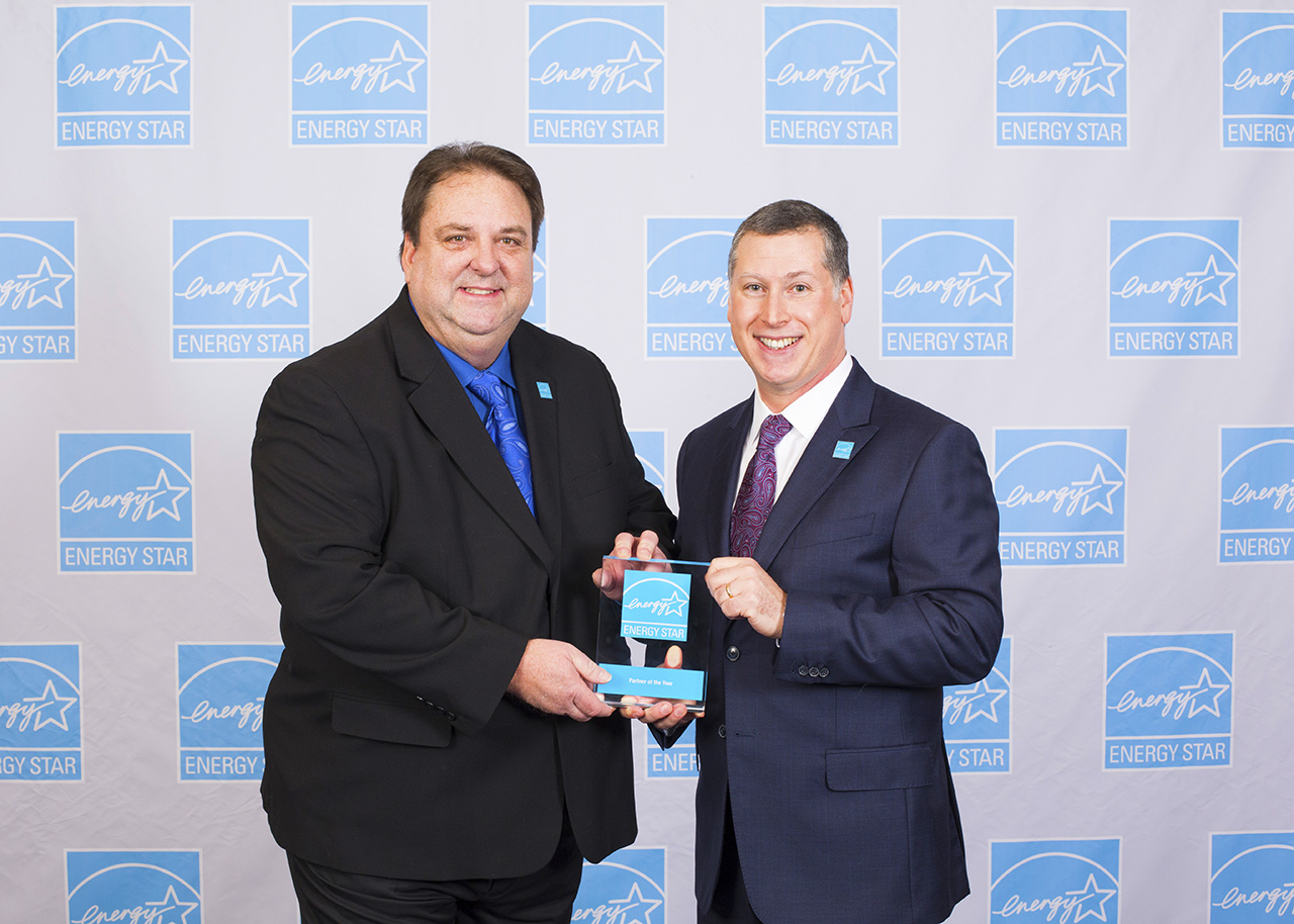 Entergy Texas’ Energy Efficiency Program Manager Kelley Carson receives the ENERGY STAR Partner of the Year award from Jonathan Passe, Chief of ENERGY STAR Residential Branch.
